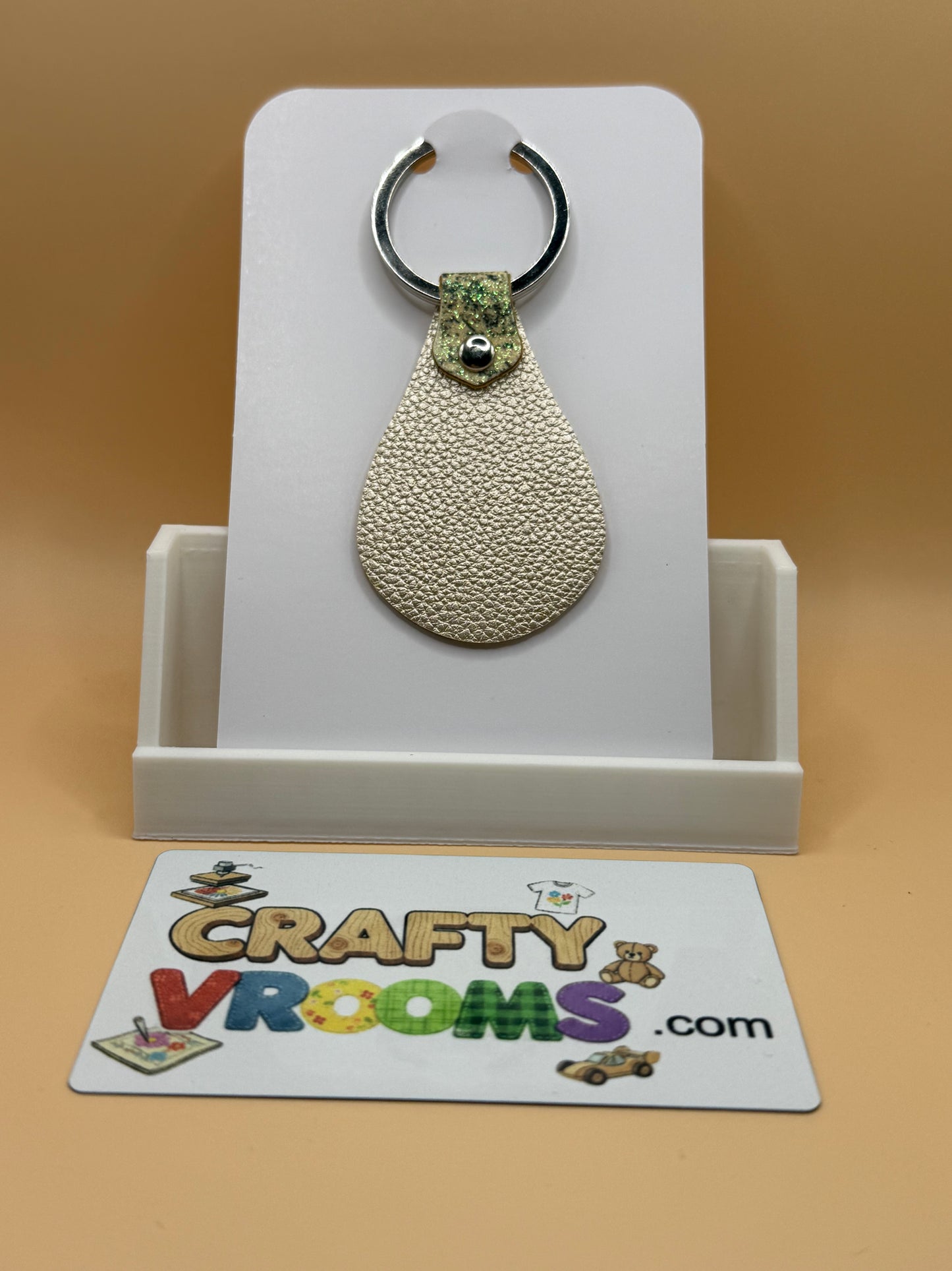 Leatherette keyholder - gold gllitter