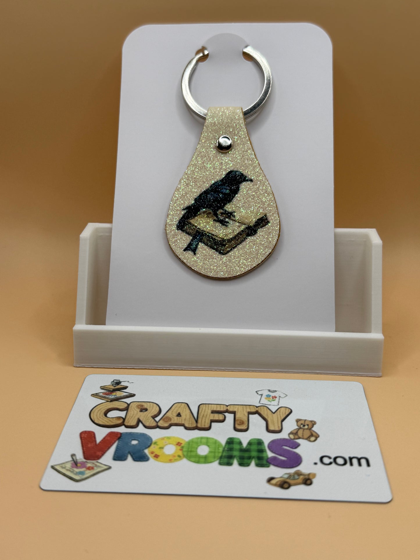 Leatherette keyholder - crow/book
