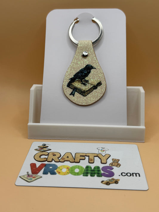 Leatherette keyholder - crow/book