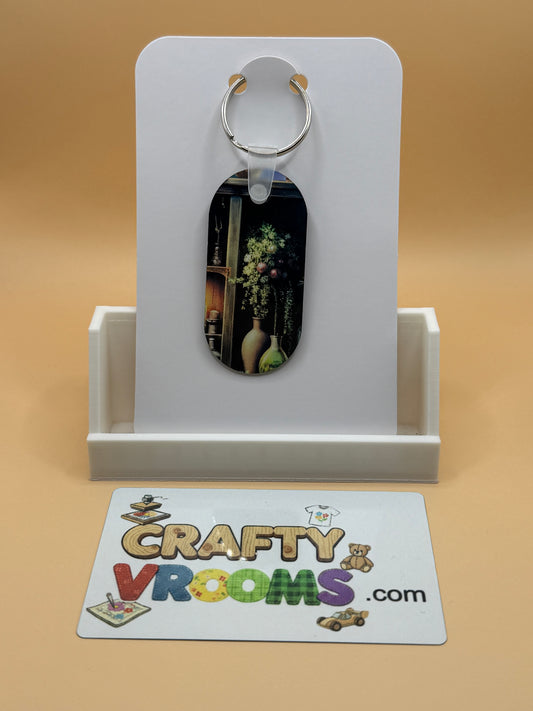 Oval keychain - Dark Academia candle lit plants